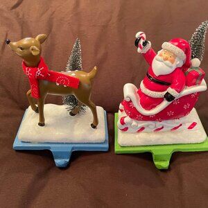 2 Stocking Holders Christmas Santa Claus Clause Deer Sleigh Bottle Brush Tree